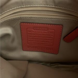 Authentic Coral Orange and tan coach purse includes charms